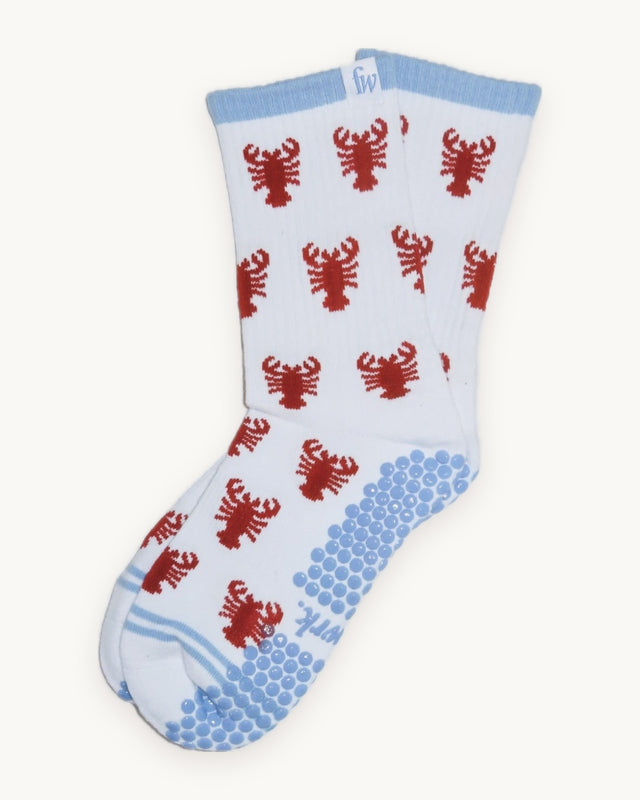 Lobster Roll grip socks with lobster print and blue grip, flat lay