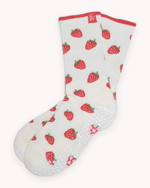 Strawberry Fields grip socks in cream with strawberry print, flat lay